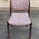 Scandinavian chair in curved solid teak wood and fabric.