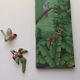 Two exotic birds in slip to hang