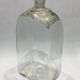 Glass bottle decorated with gold motifs