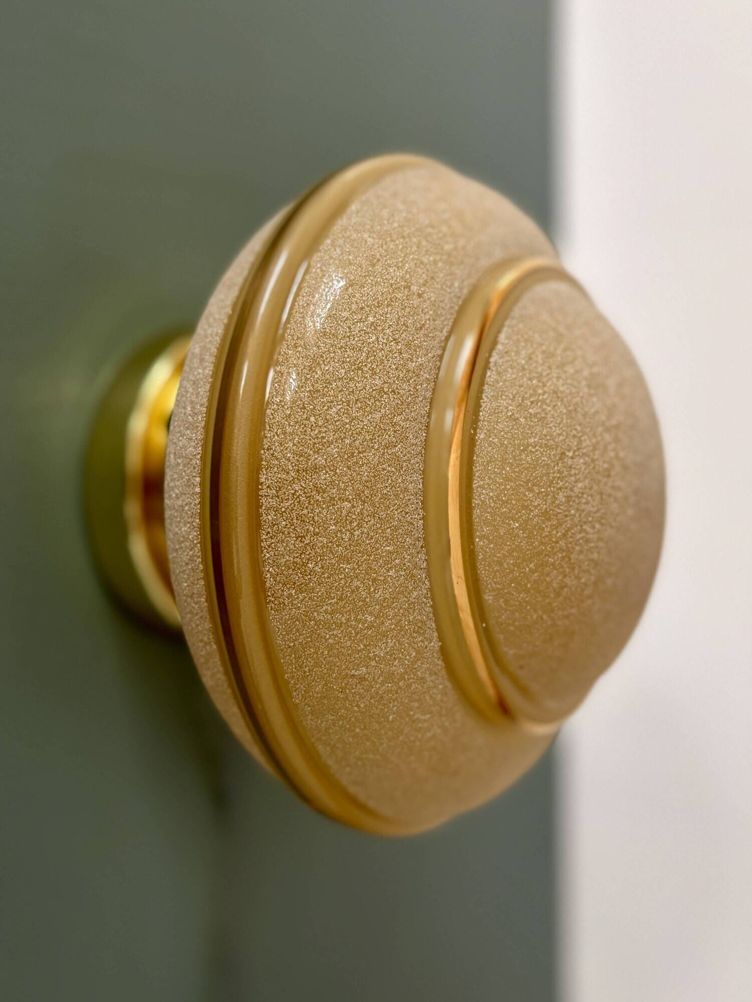 Vintage Art Deco globe wall/ceiling light in frosted yellow and gold glass.