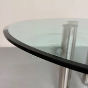 Round glass and metal dining table, Italian design from the 80s, vintage