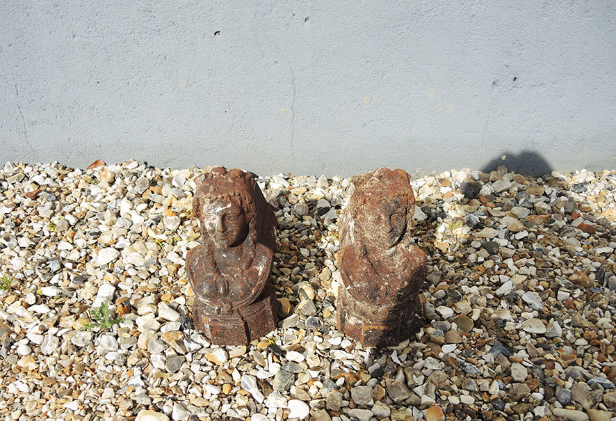 Old cast iron chenets bust of woman with braids