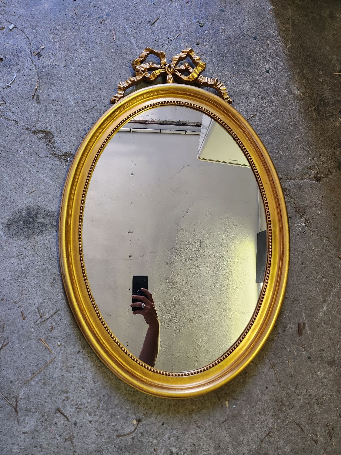 Vintage oval bow tie mirror