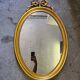 Vintage oval bow tie mirror
