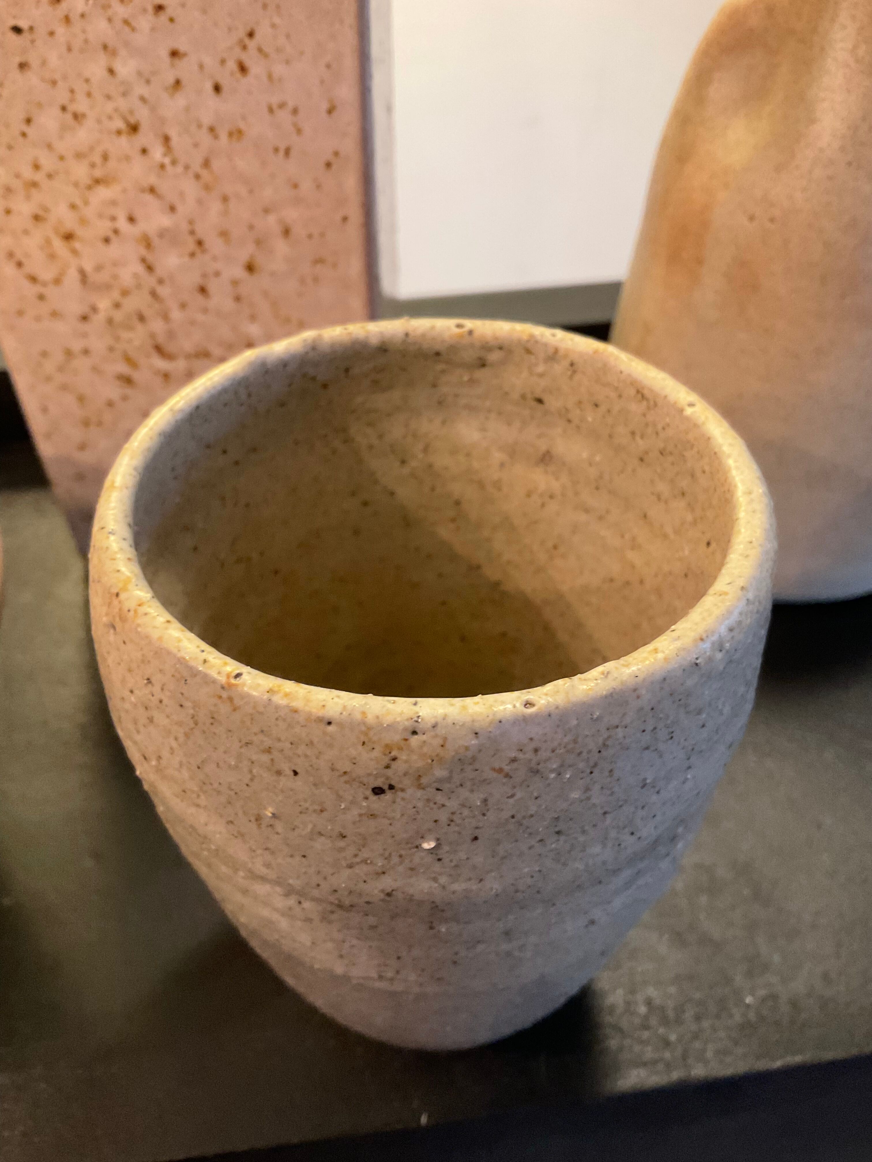 Series of 5 vintage beige ceramic vases