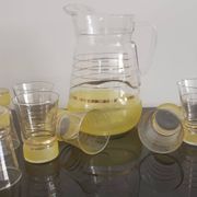 Old pitcher with its 8 yellow granite glasses with gold edging vintage 50's