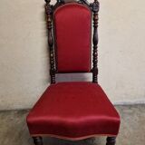 Chair known as a "chauffeuse" from the Napoléon III period, made of carved moulded wood.