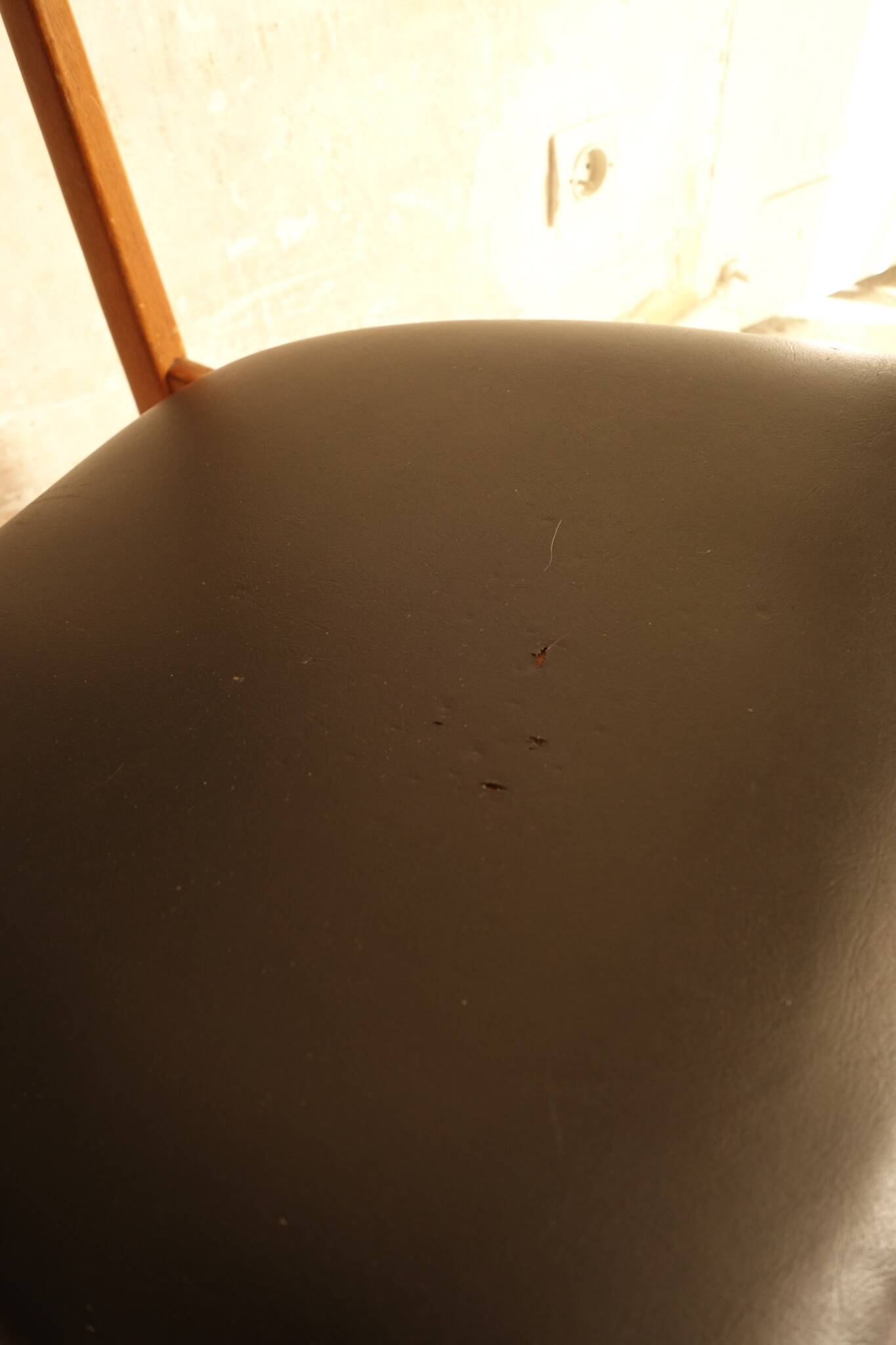 Pair of modernist Scandinavian chairs in teak and black faux leather.