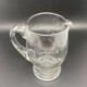 Glass jug with chiseled pattern