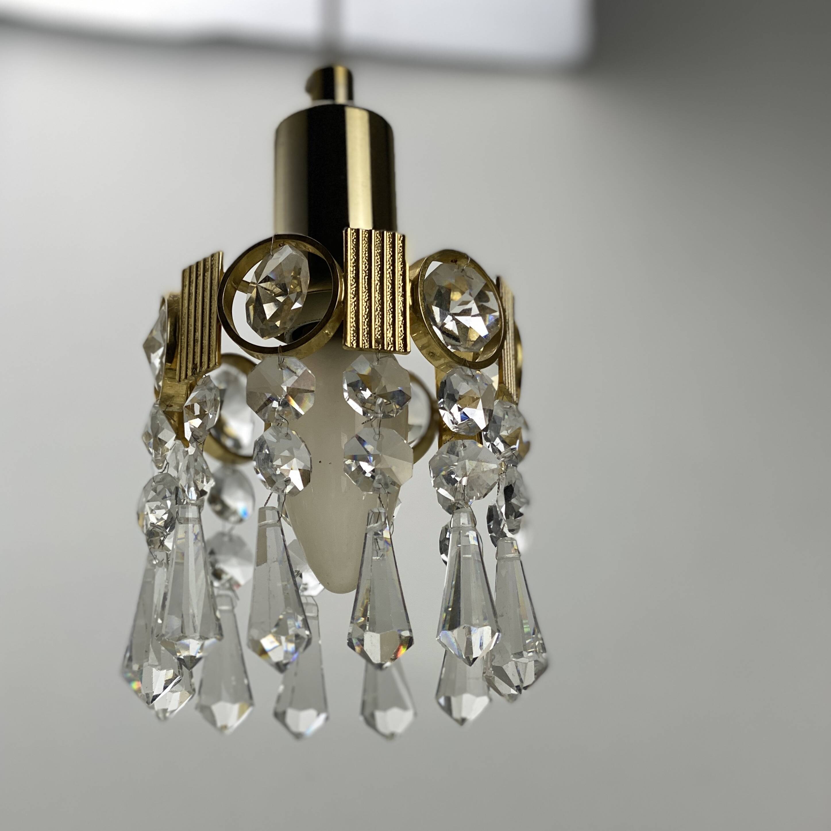 Two gold-plated brass and crystal pendant lights, by Palwa, 1960s design, Hollywood Regency.