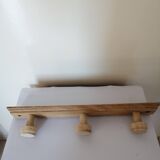 Old wall coat rack in raw wood
