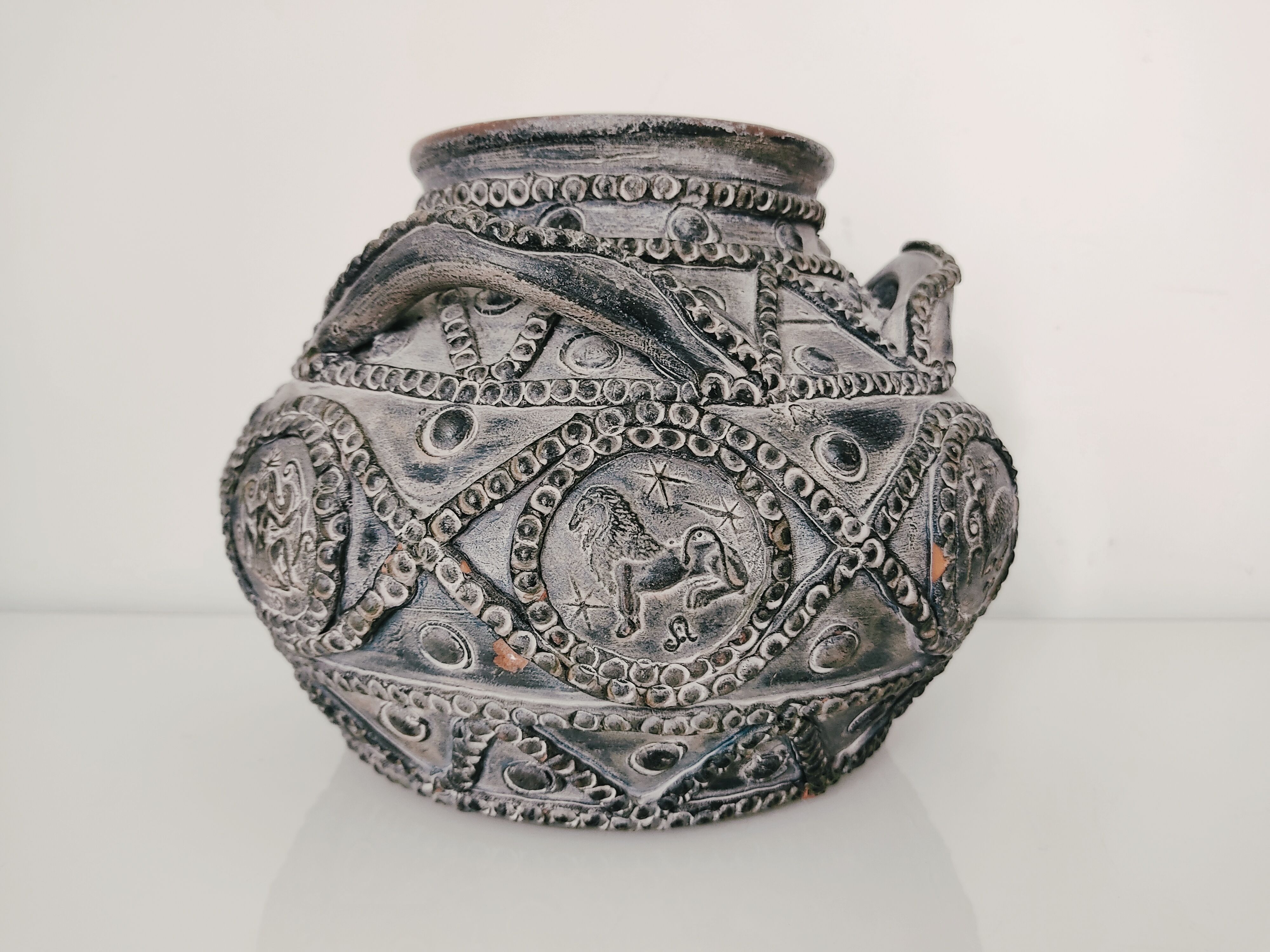 Terracotta vase with decoration astrological signs