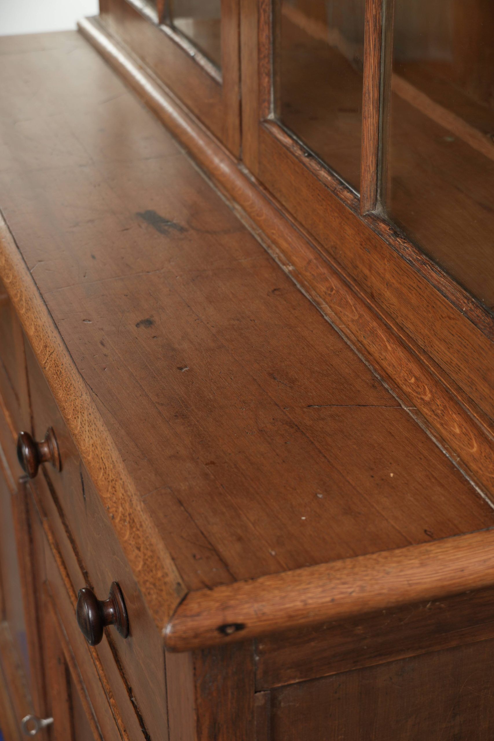 Antique English oak buffet/bookcase from 19th century with original glass