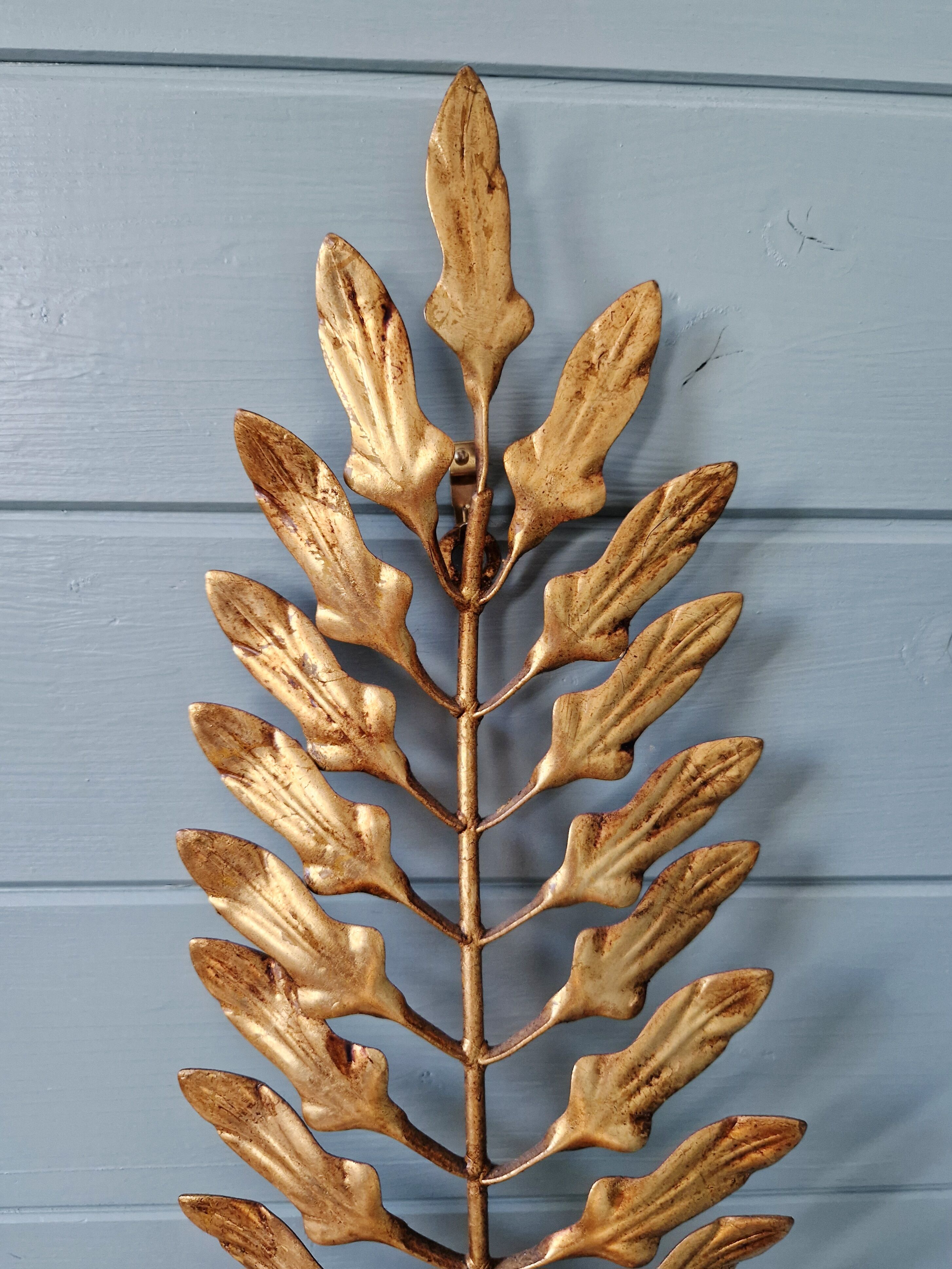 Pair of gold metal wall sconces in Hollywood Regency style, 1970s.