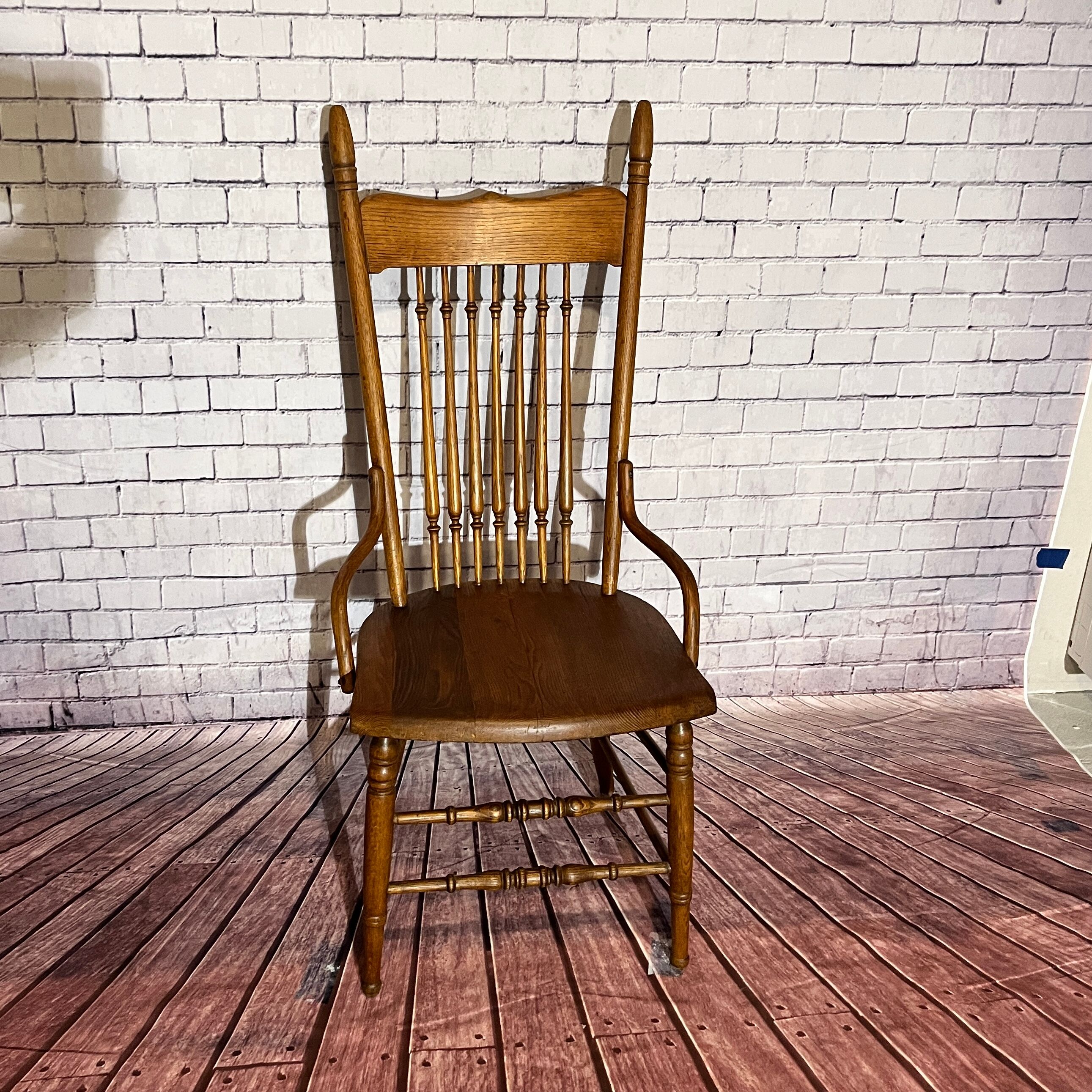 Wooden armchair with high back