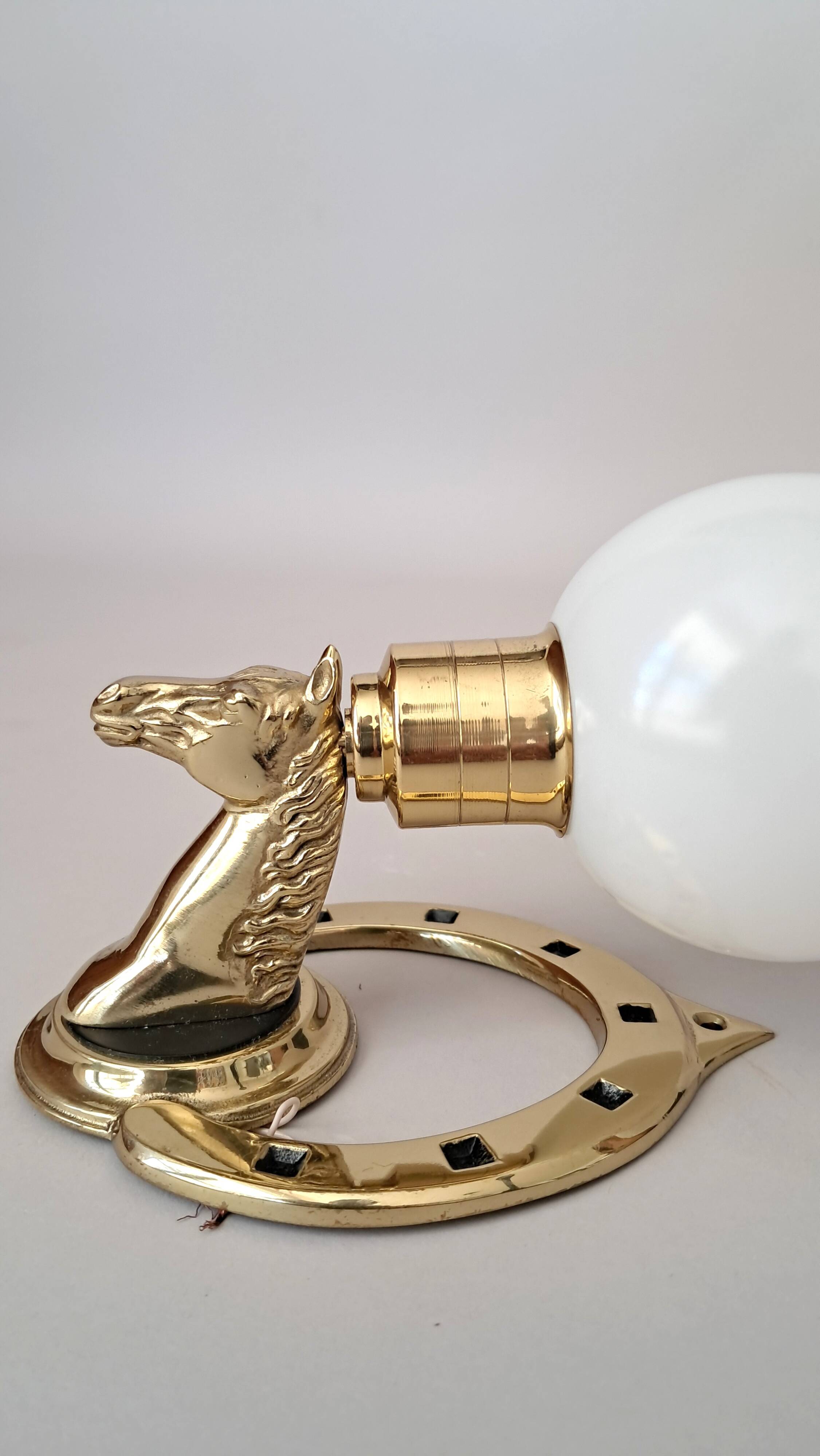 Gilded bronze wall lamp with iron and horse head 1950/1960.