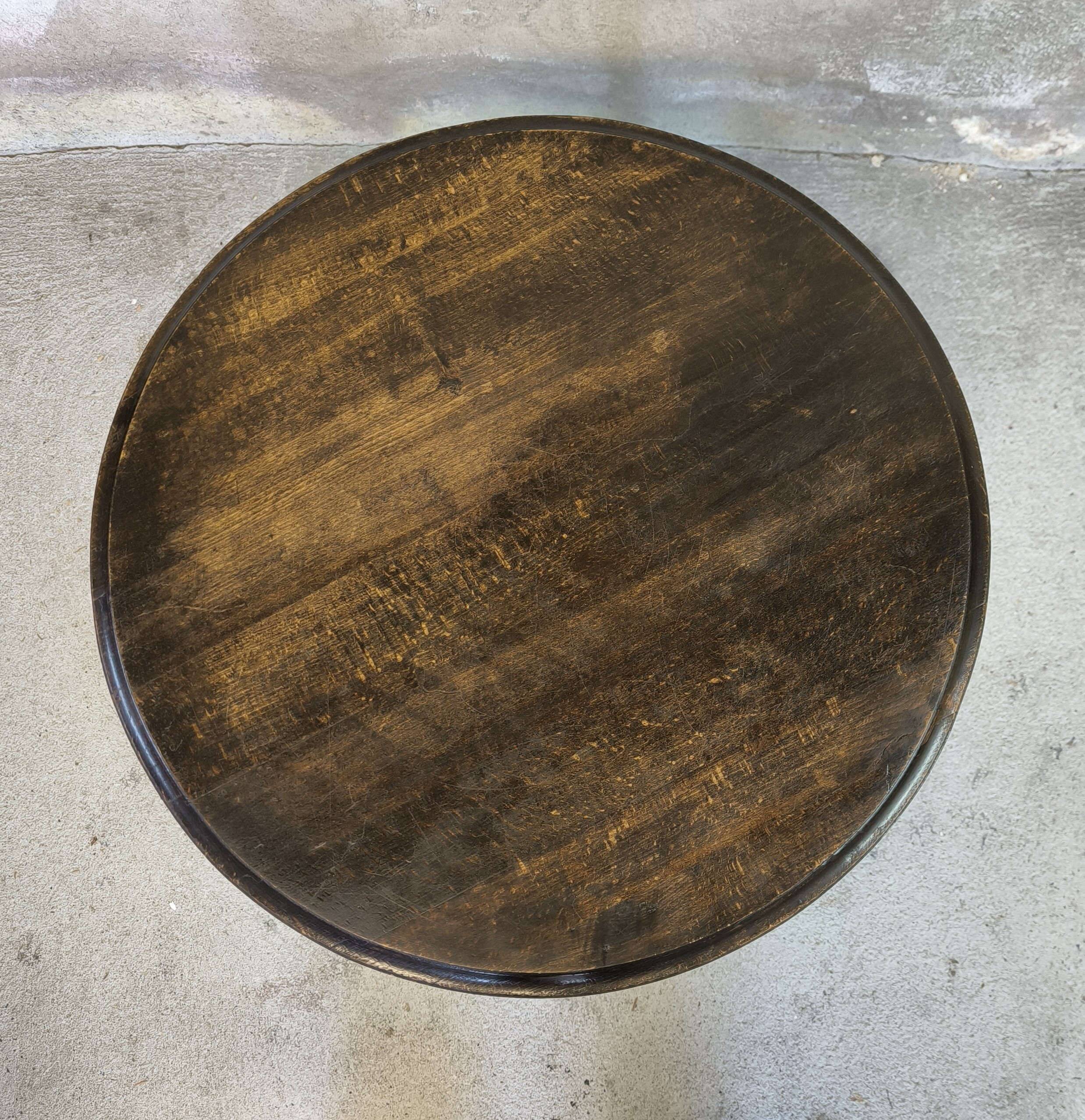 Vintage gueridon with beaded wooden legs.