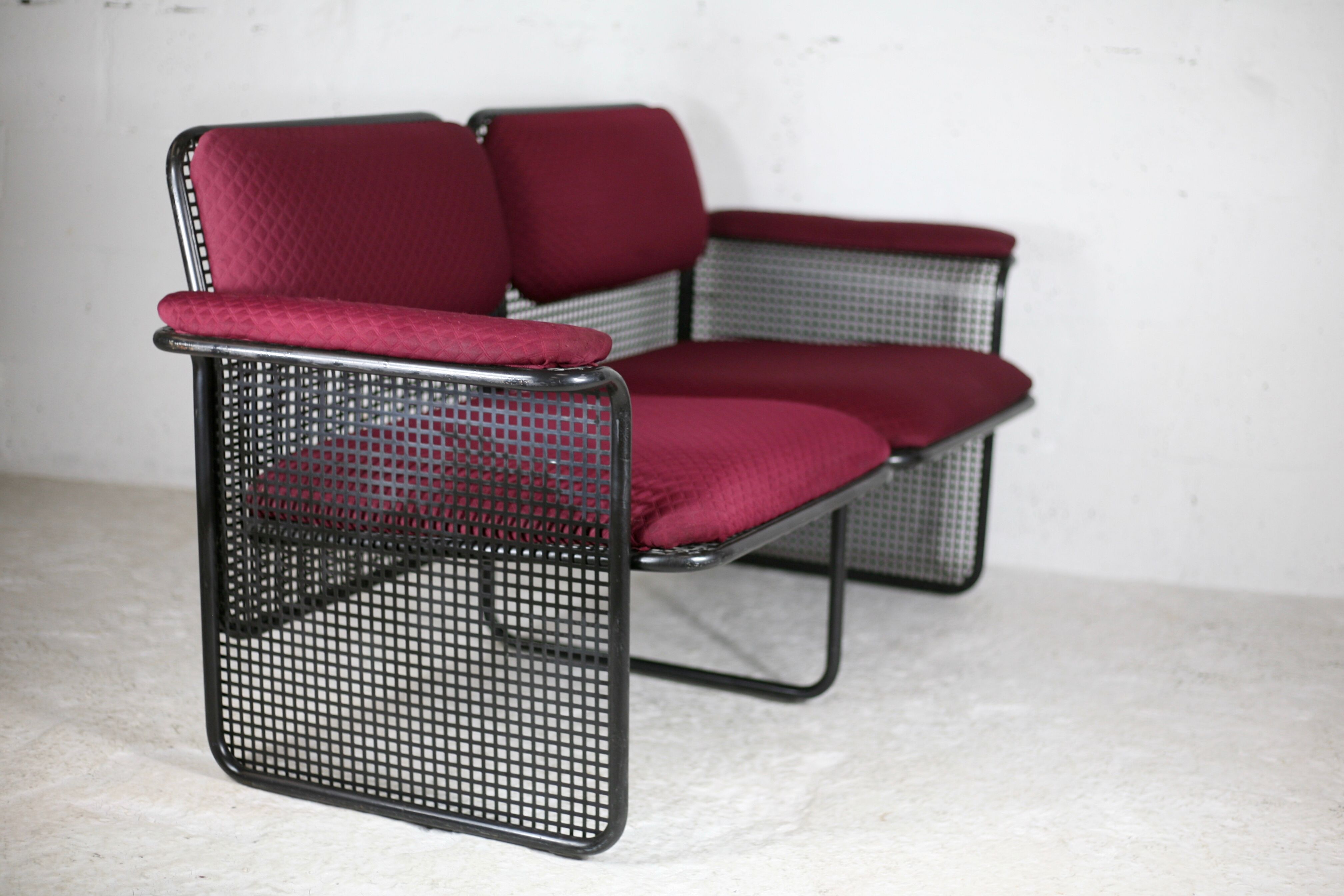 Black honeycomb steel sofa, burgundy fabrics, Italy, circa 1970