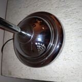 Articulated chromed metal lamp