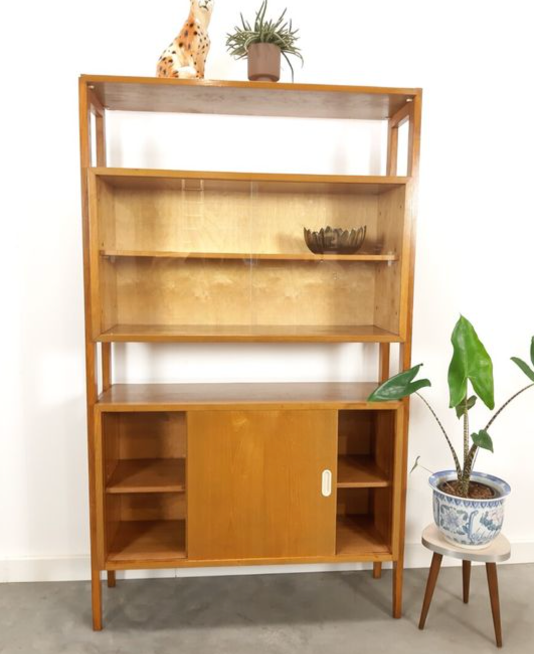 Vintage wooden showcase with sliding doors and white handles