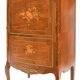In-between furniture in marquetry decorated with a trophy decoration of musical instruments