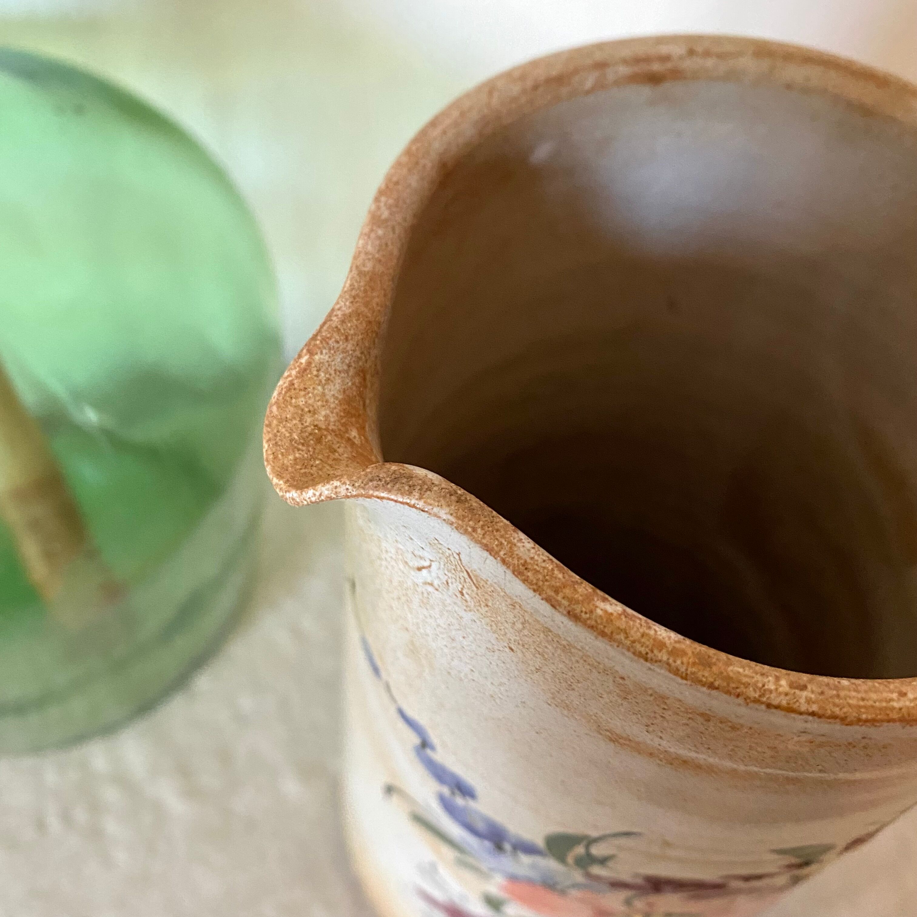 Stoneware pitcher with floral decoration