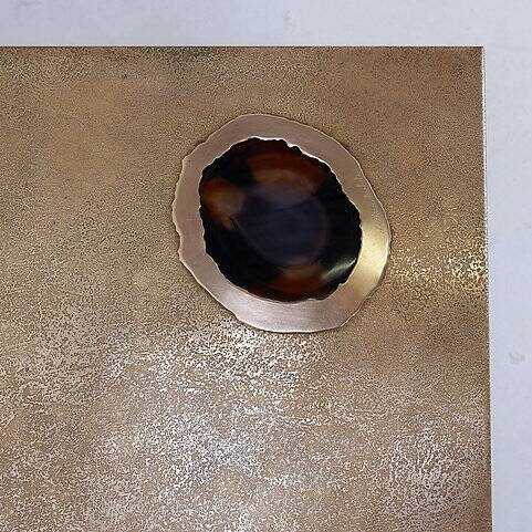 Acid-etched brass coffee table top by Christian Krekels with an agate stone