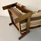 Vintage 1970s design armchair made of wood and fabric.