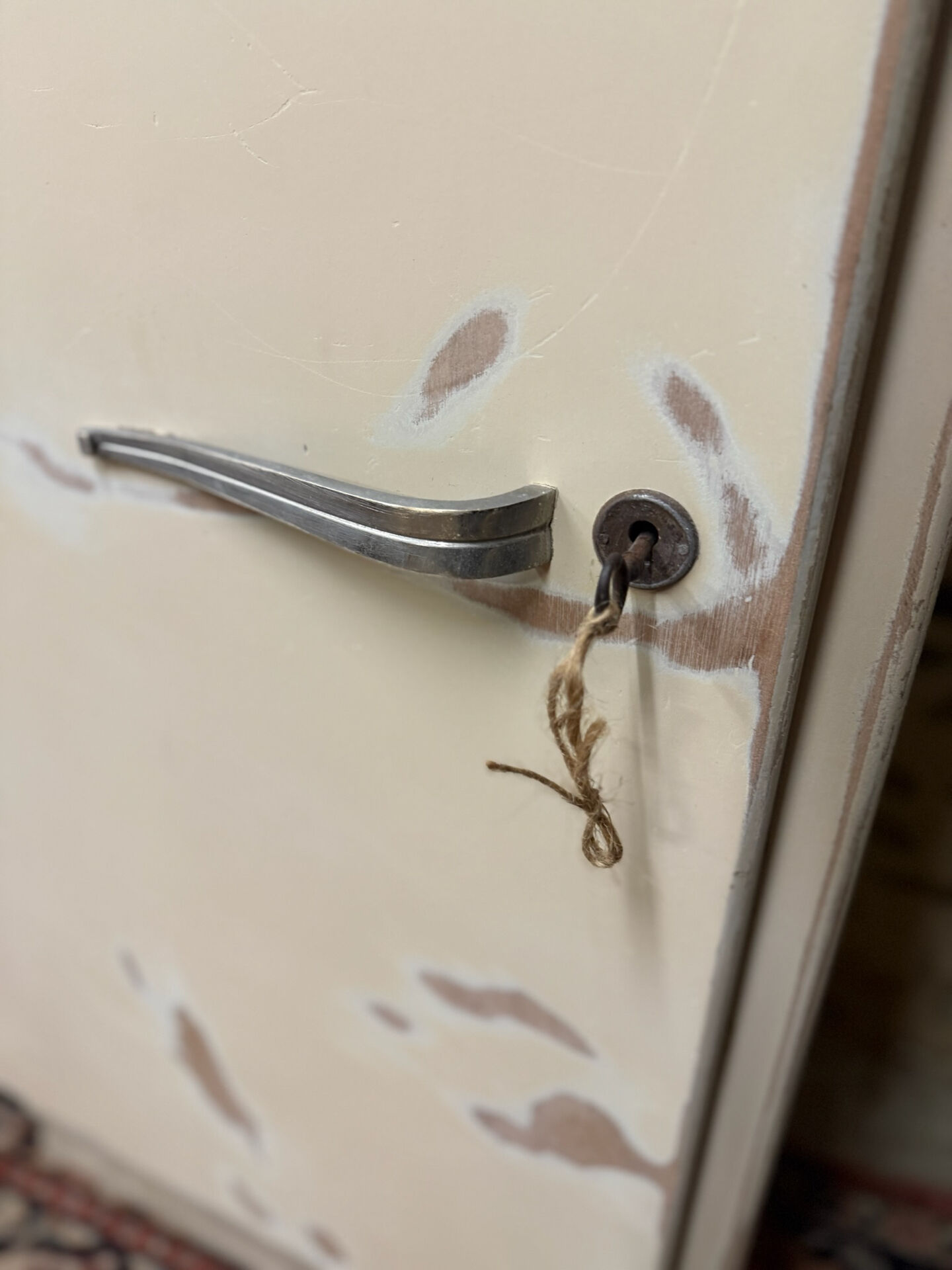 Small one-door Art Deco cabinet with a patina.