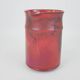 Red glazed ceramic jug with relief