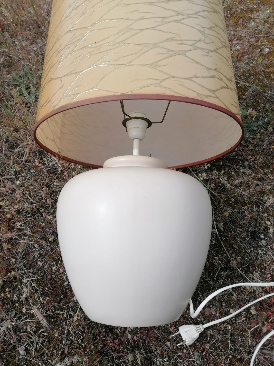 Vintage ceramic table lamp and golden lampshade.