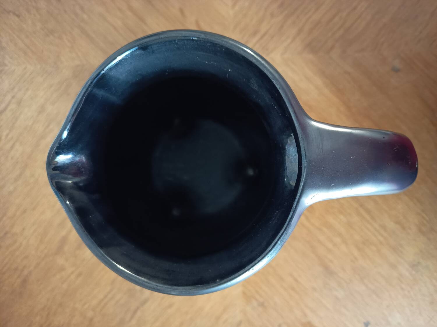 Black ceramic tripod jug