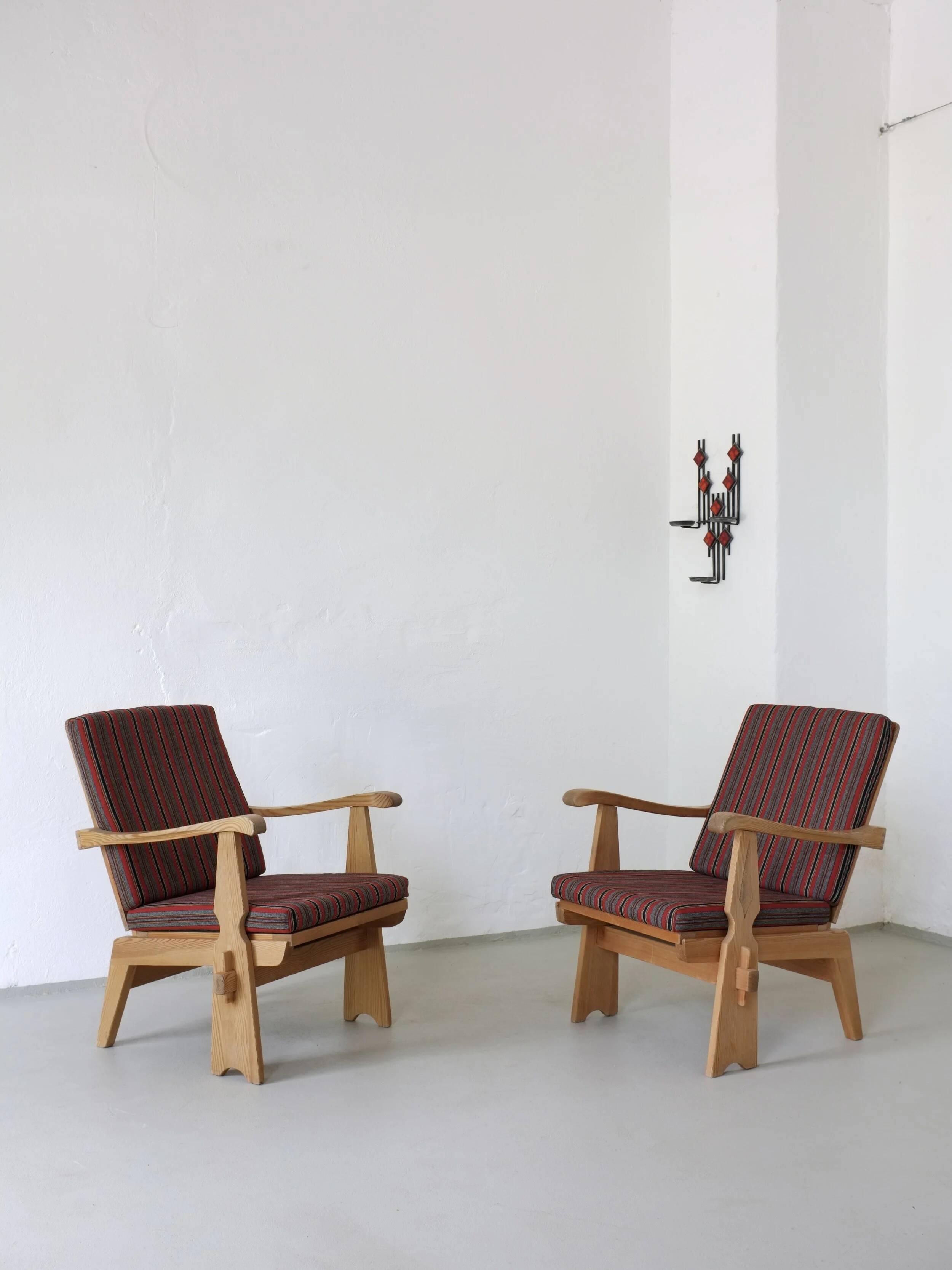 2 carved pine lounge chairs | Scandinavia | 1970s