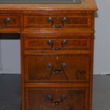 Partner desk in burr walnut designed to conceal computer equipment.