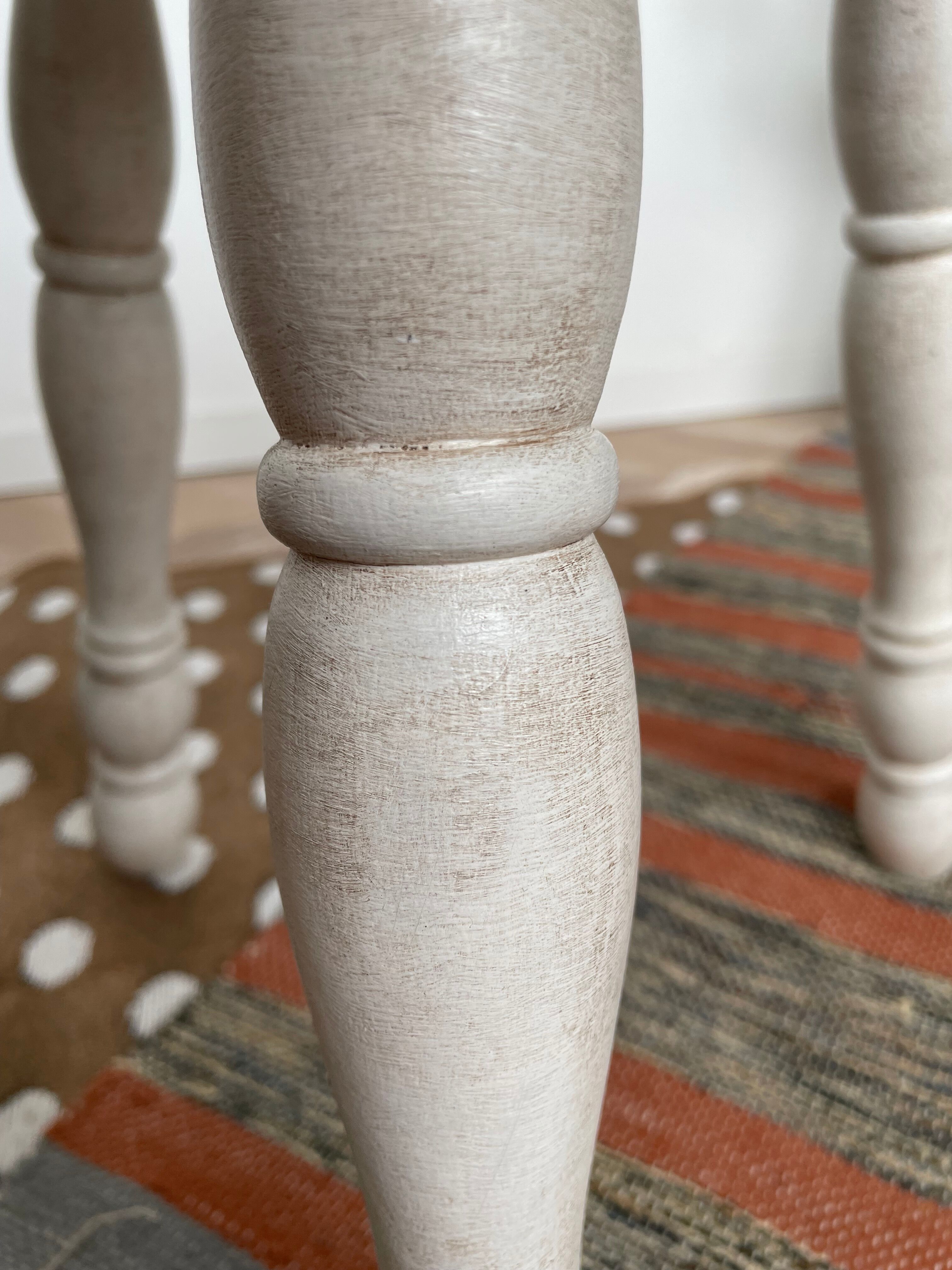 Patinated white tripod