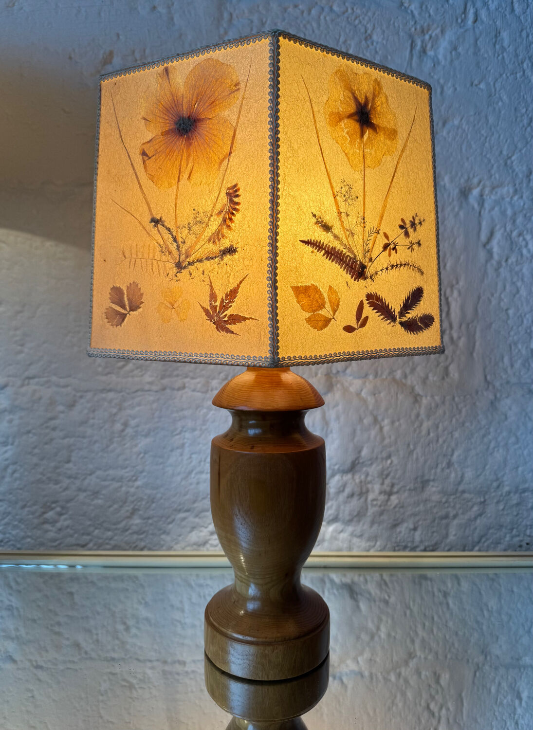 Turned wood lamp with a herbarium lampshade from the 1970s.