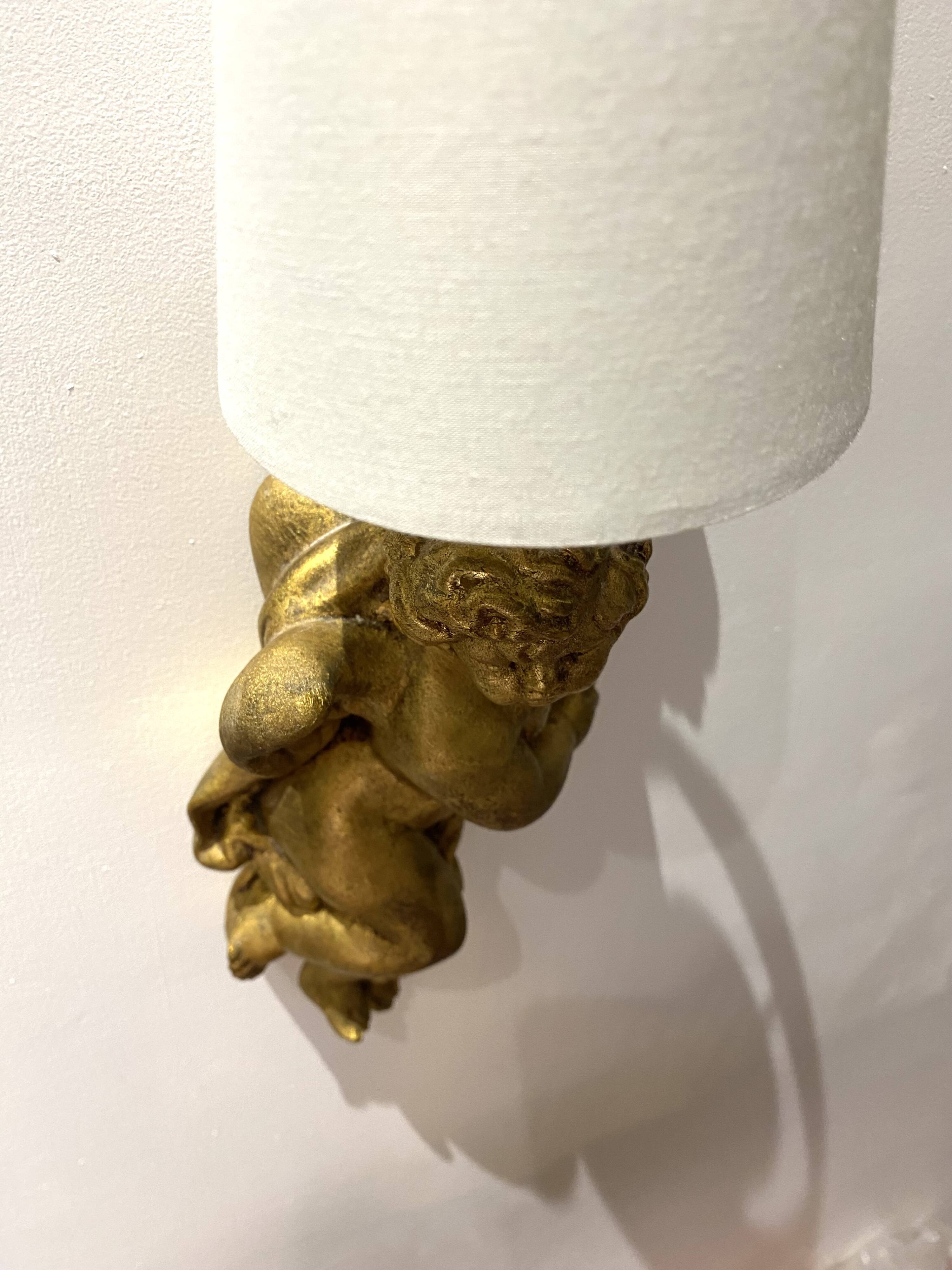 Pair of golden Puttis wall lights