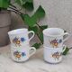 Coffee cup with floral design in porcelain