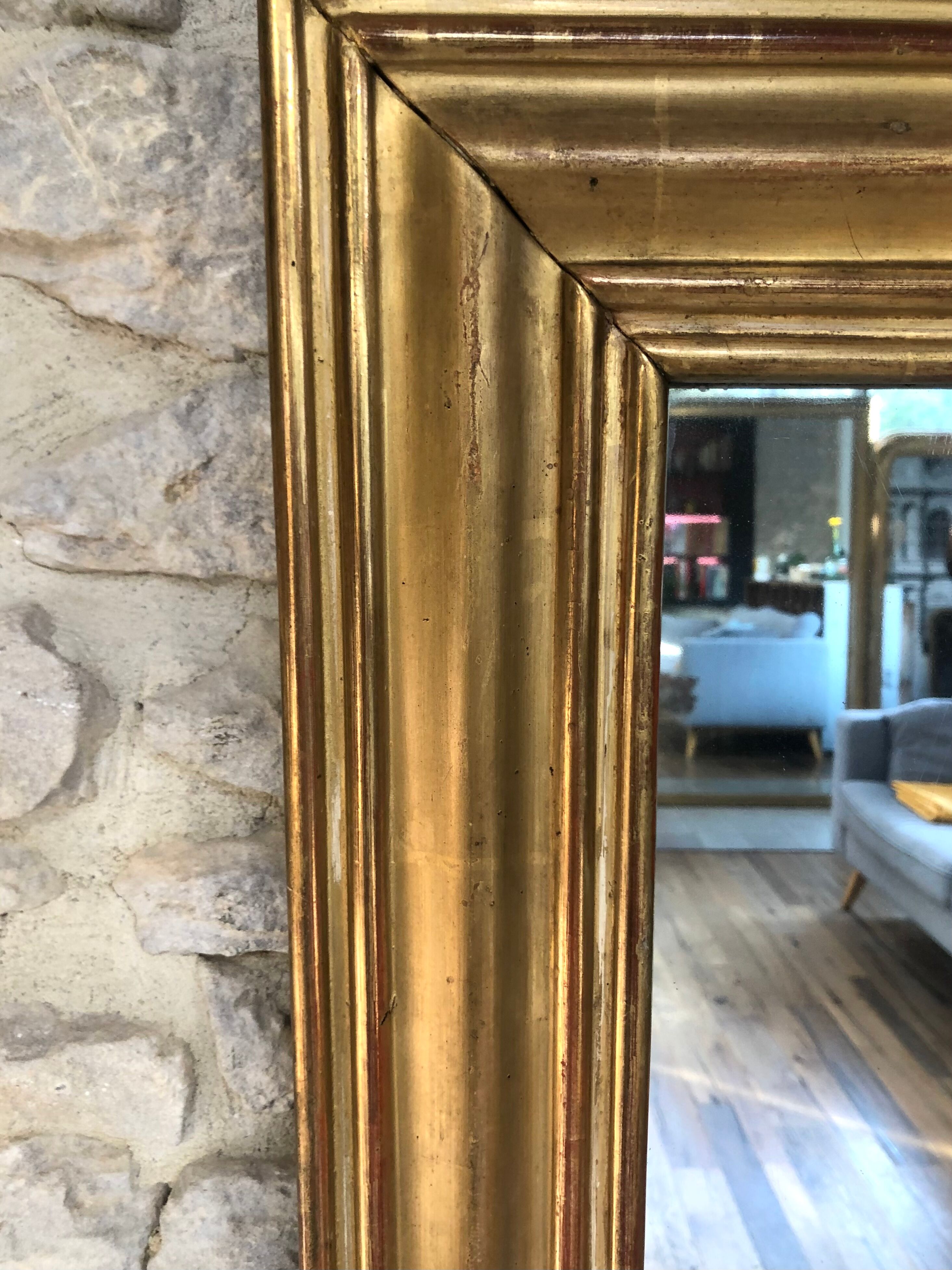 Mirror period 19th gilded with gold leaf 158.5cm / 113cm mercury ice pricked, parquet on the back.