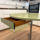 Round extendable folding Formica table with metal legs from the 50s/60s in green.