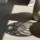 Suspension or rattan lampshade in the shape of a woven bulb.