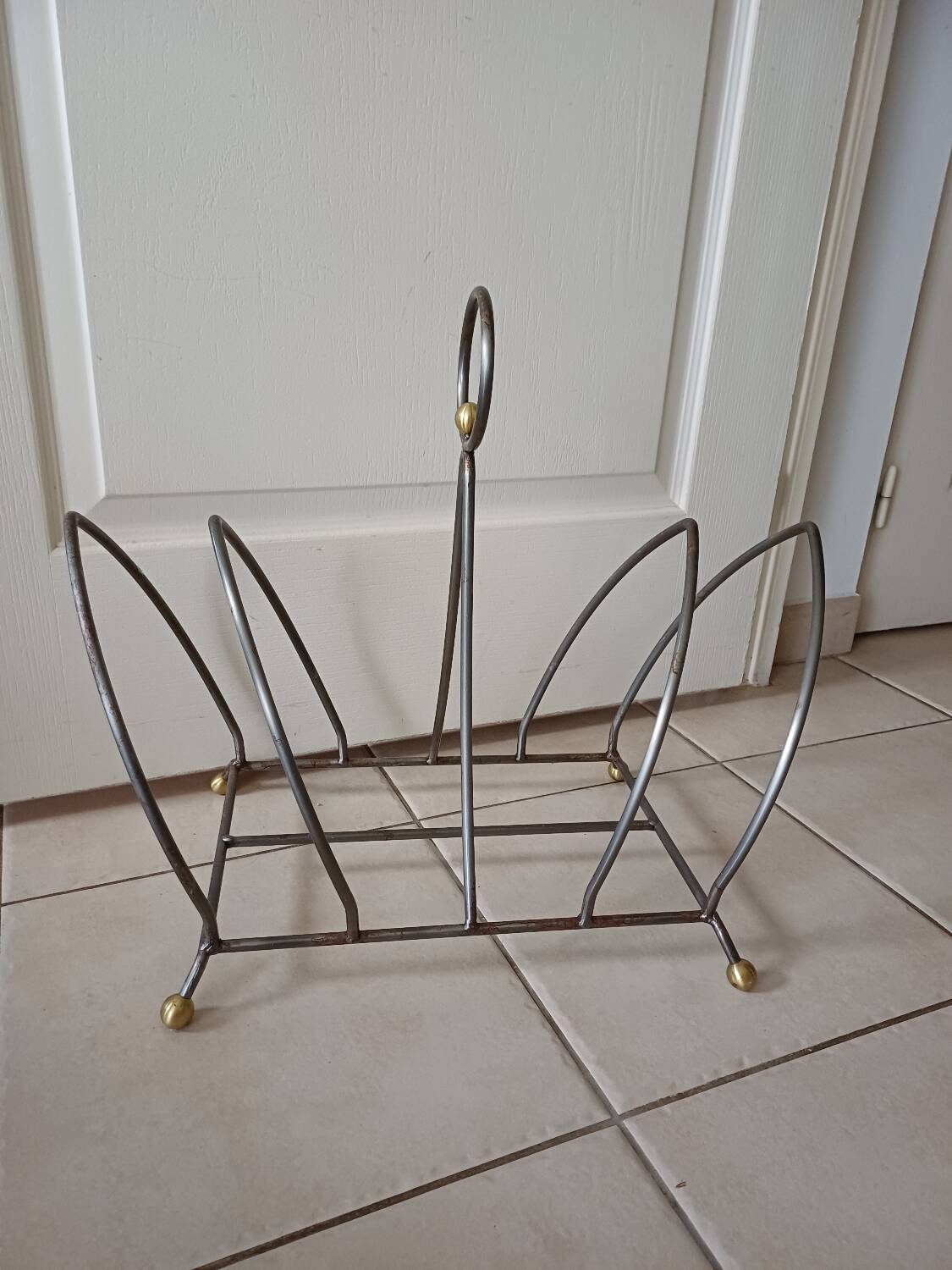 Vintage magazine rack with brass legs