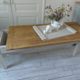 Coffee table made from an authentic farmhouse table, leg patinated pearl gray