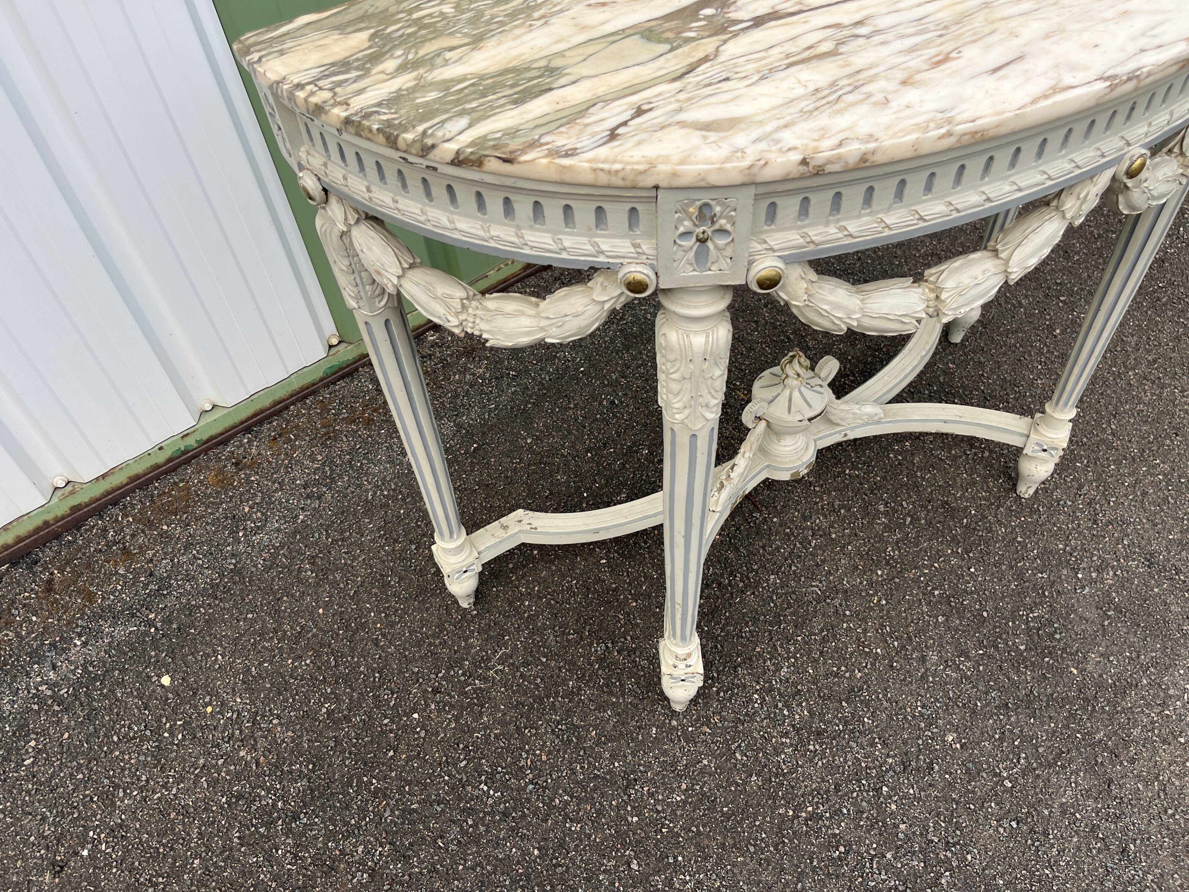 Louis XVI style half-moon console table with carved and painted wood and marble top