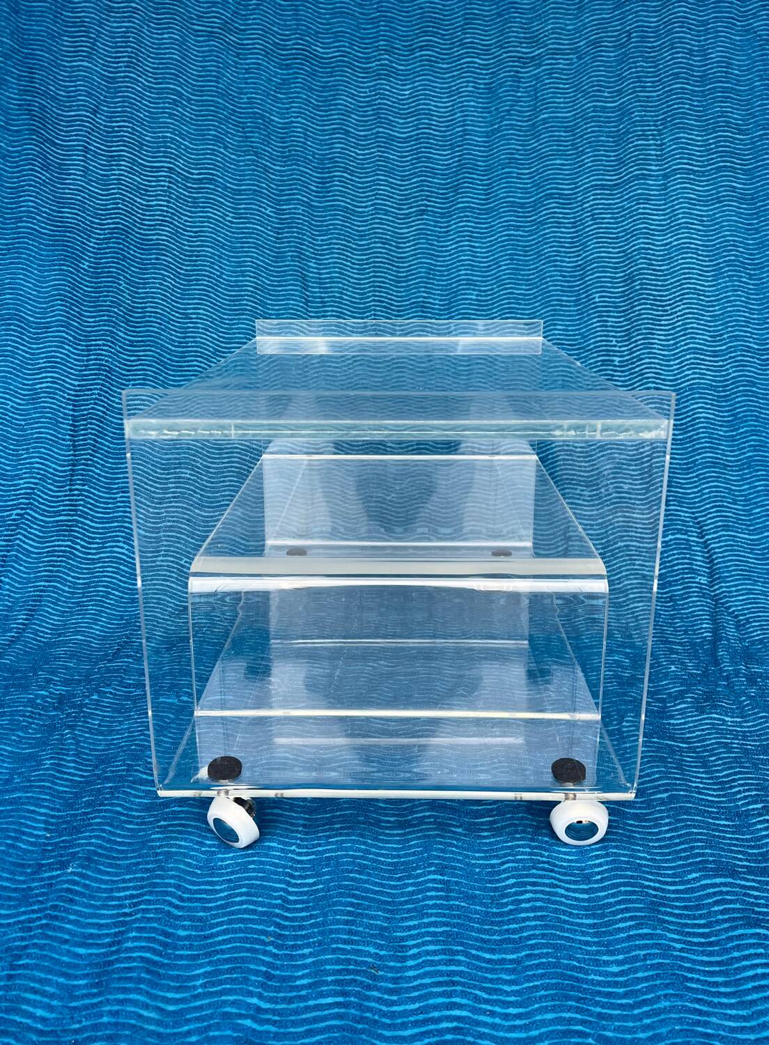 Translucent plexiglass storage drawer/cabinet on wheels.