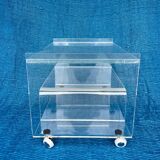 Translucent plexiglass storage drawer/cabinet on wheels.