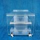 Translucent plexiglass storage drawer/cabinet on wheels.