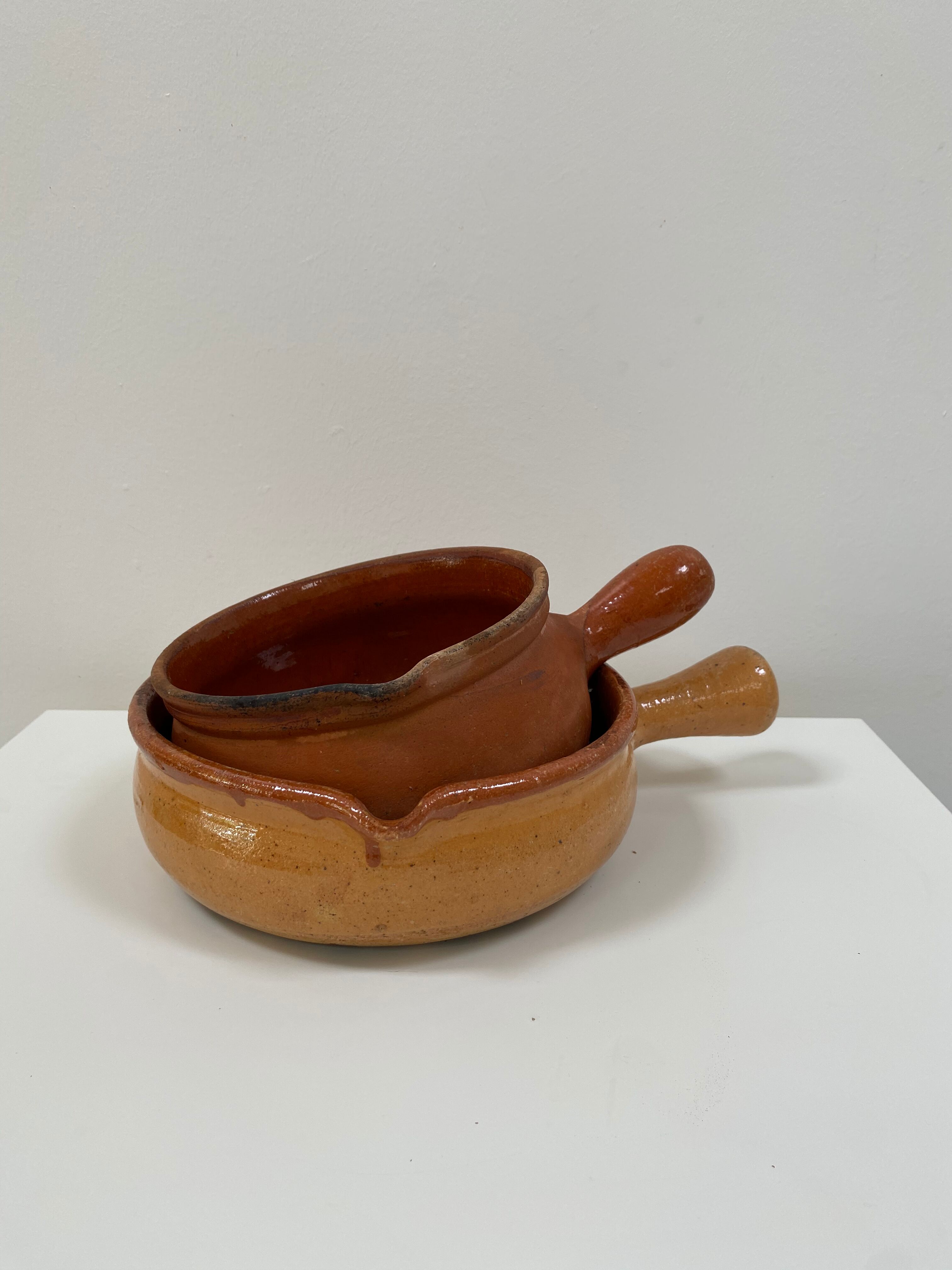 Pair of old pocket pots in glazed stoneware