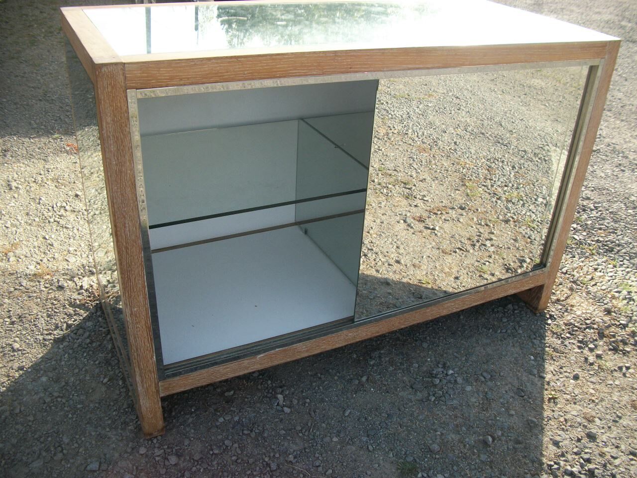 Small vintage buffet of commerce surrounded by mirrors