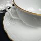 Tharaud Limoges white porcelain cups and saucers with gold relief